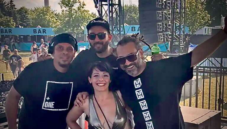 Four DJ in a group smiling