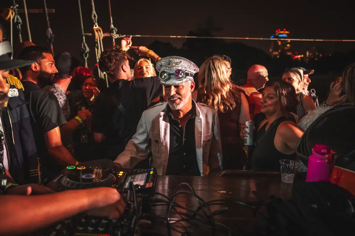 Party man wth cap on a boat