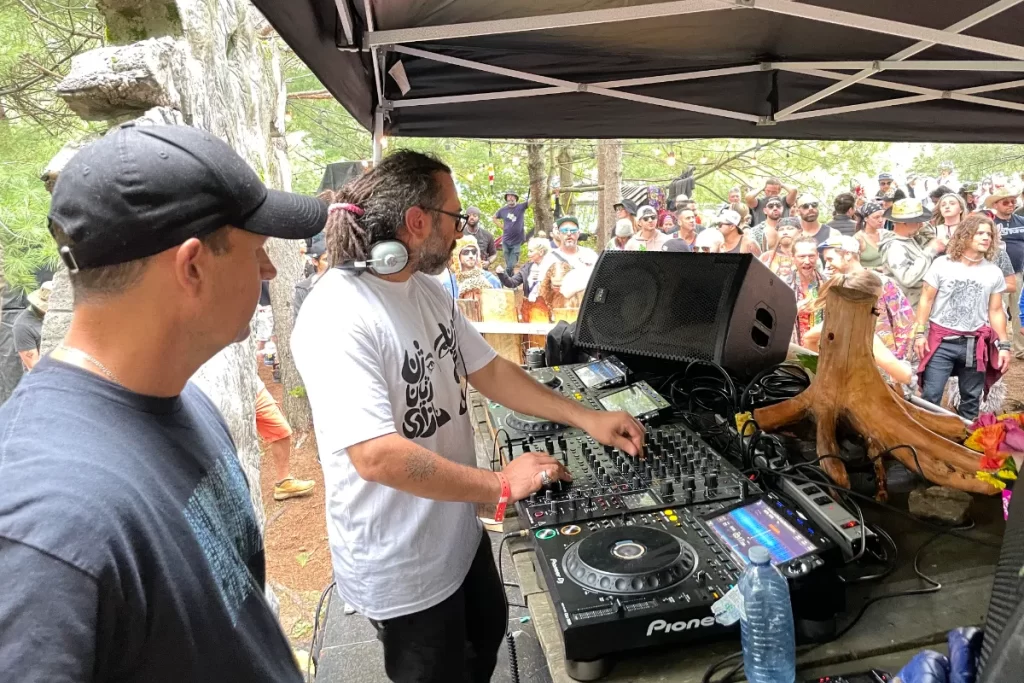 Man DJing in whote T-shirt