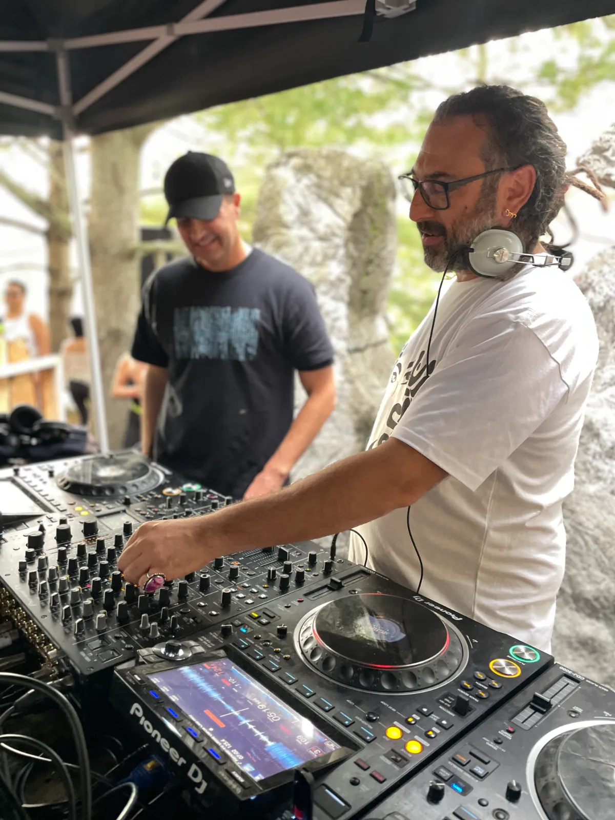 Man DJing in whote T-shirt