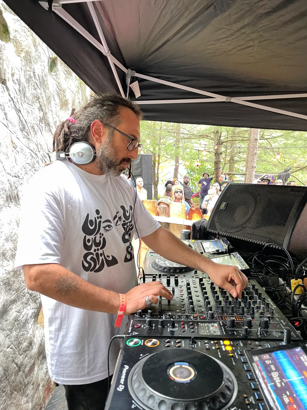 Man DJing in whote T-shirt