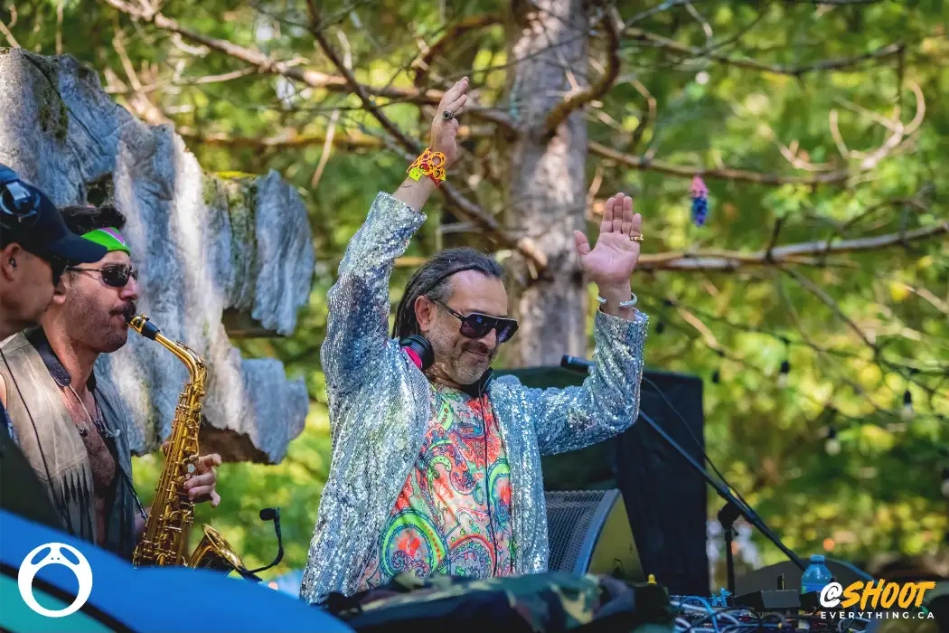 DJ  with arms up high